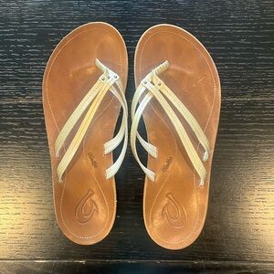 Gold OluKai Flip Flops